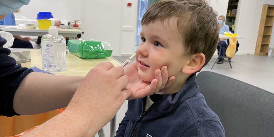 young child receiving vaccine