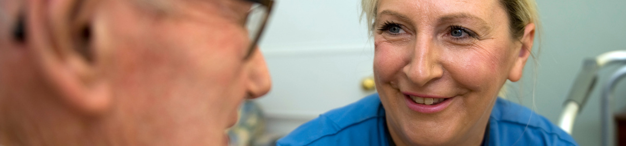 Nurse talking to older patient