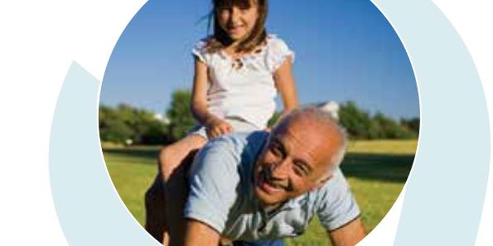 young girl sitting on older mans back both laughing