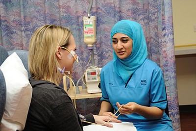 nurse sitting with patient