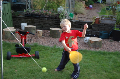 Child playing swing ball