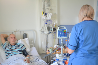 nurse beside instruments with patient