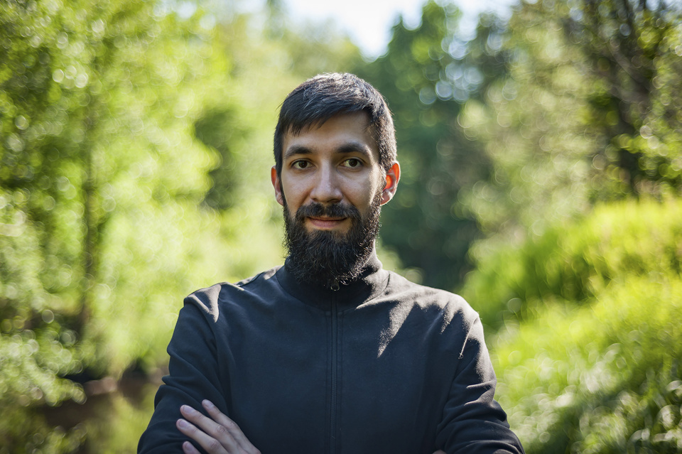 Man smiling in forest background