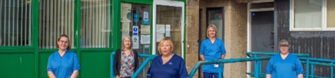 BABS team standing outside rosewell clinic