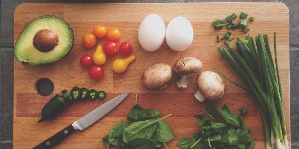 chopping board with vegetables on it