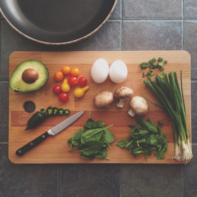 chopping board with vegetables on it