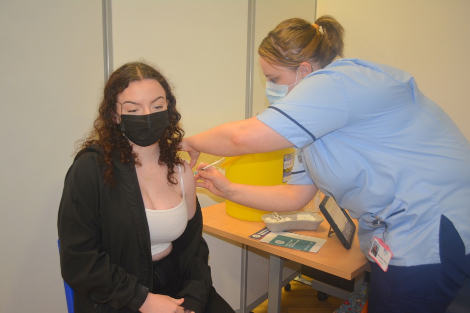 Teenage girl vaccine wearing mask