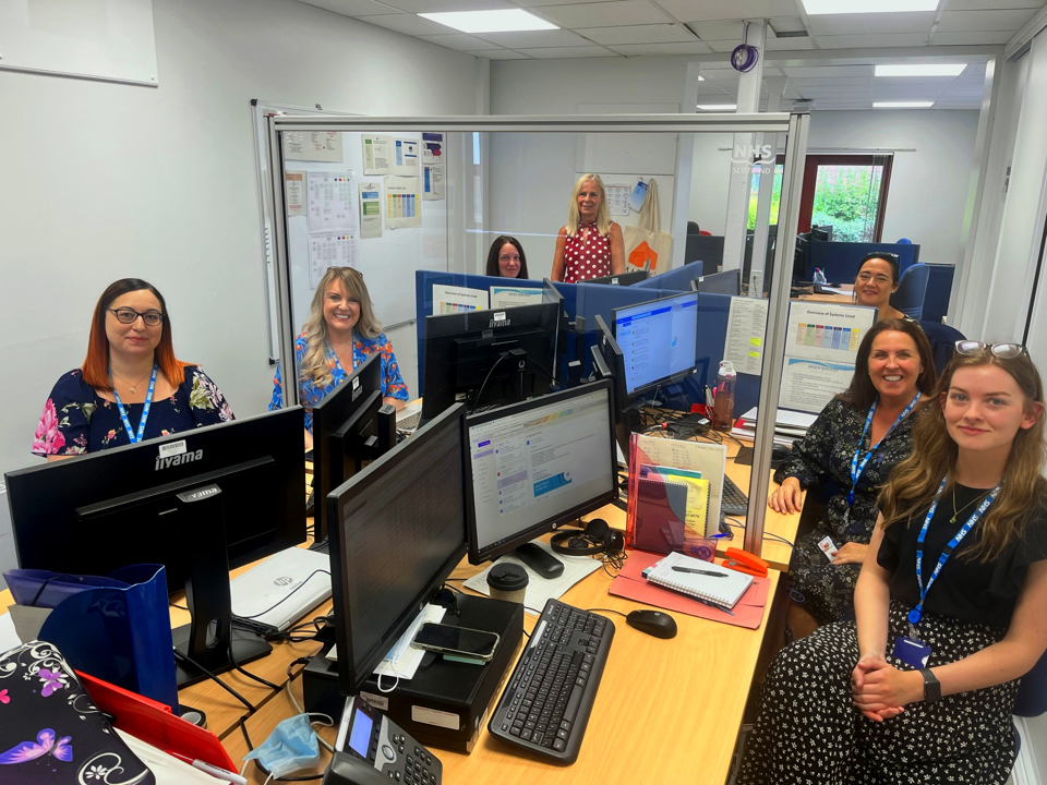 staff sitting around office